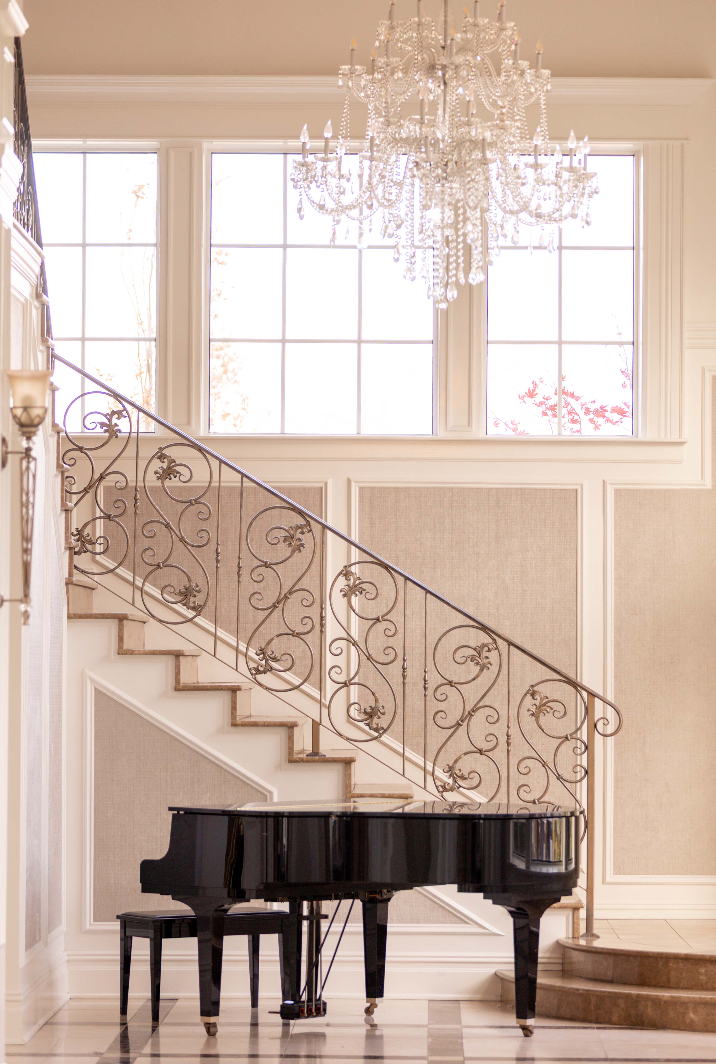 aria staircase with a piano in the corner