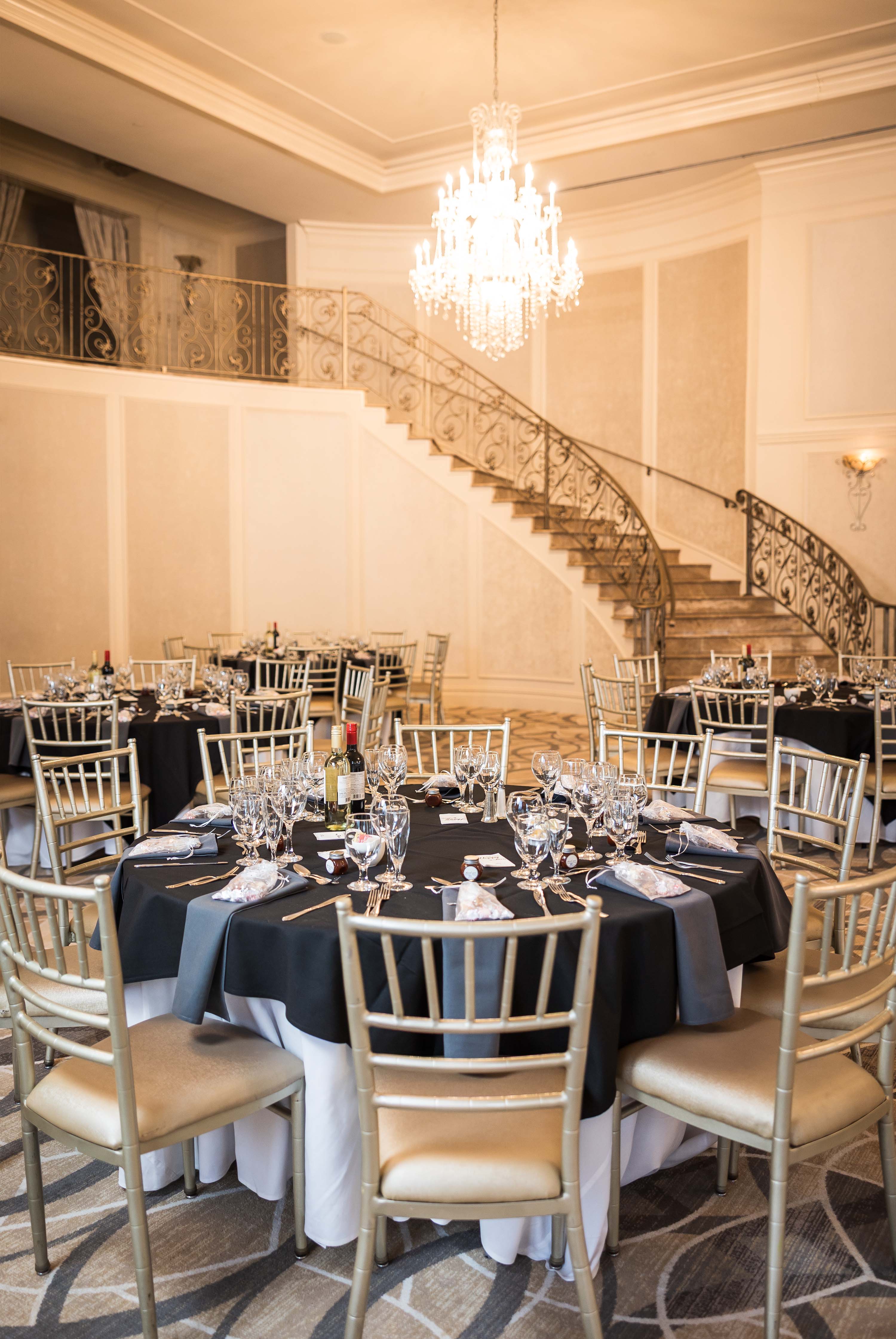 aria's ballroom tables set for a reception with black table cloths