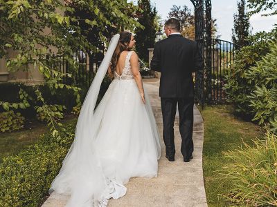 the bride and groom walking outside