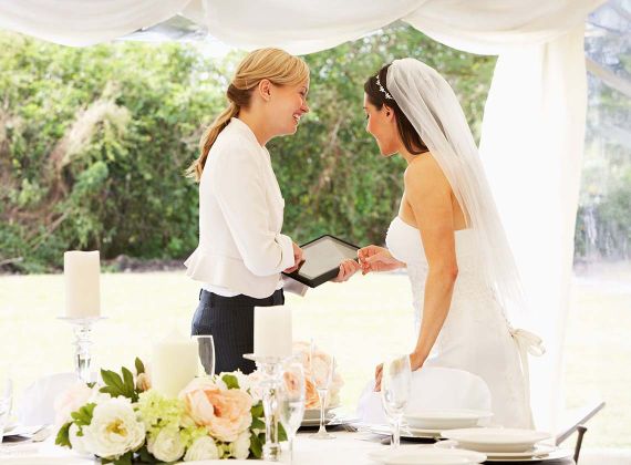 wedding planner helping a bride