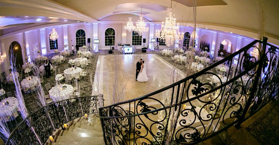 a bride and groom dancing in aria's ballroom 